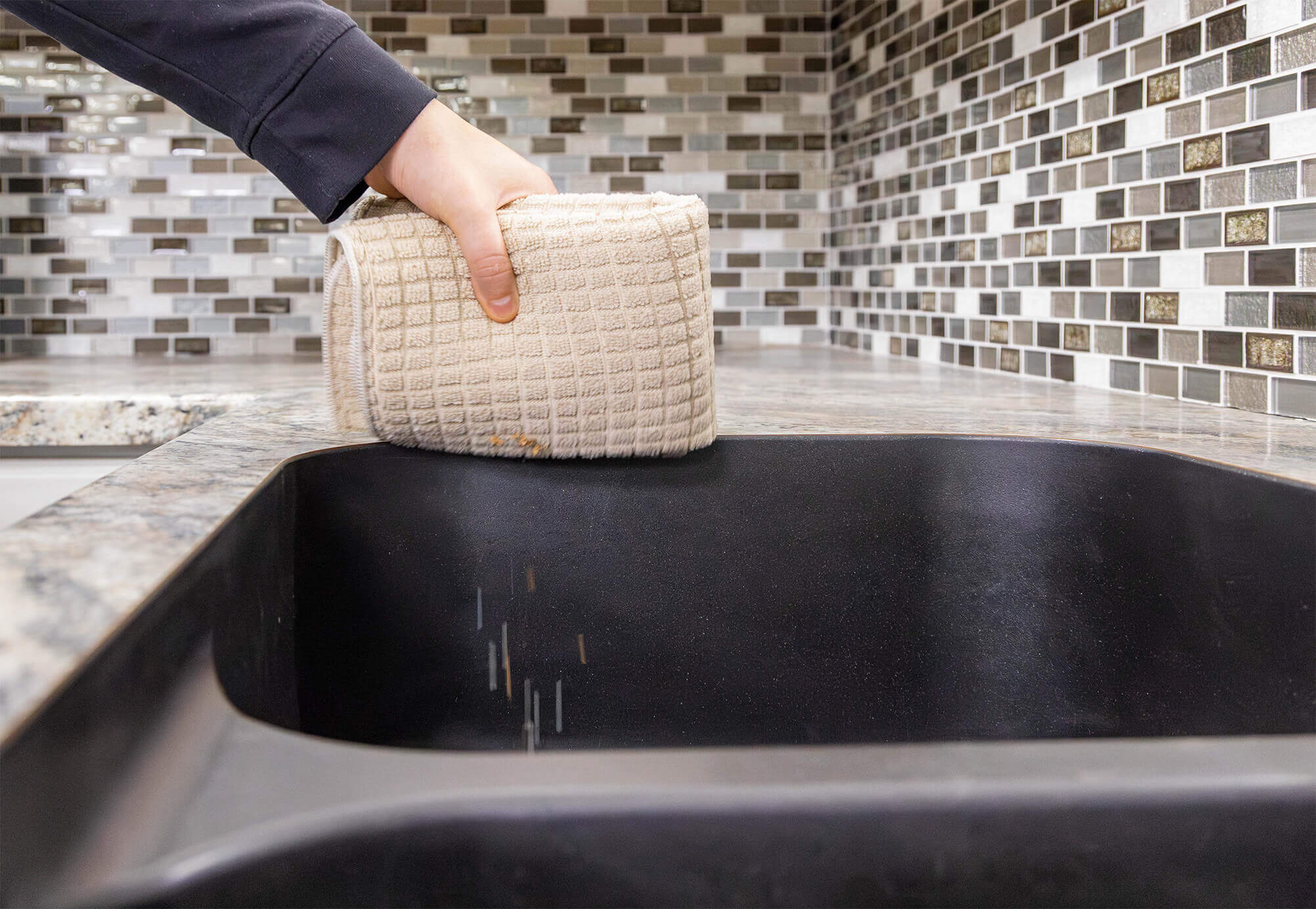 Sweeping Crumbs Into A Sink