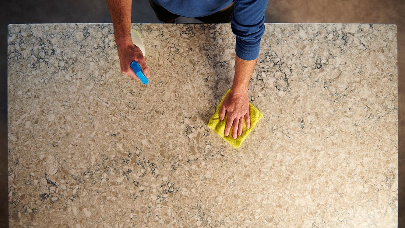 Man Cleaning Countertop